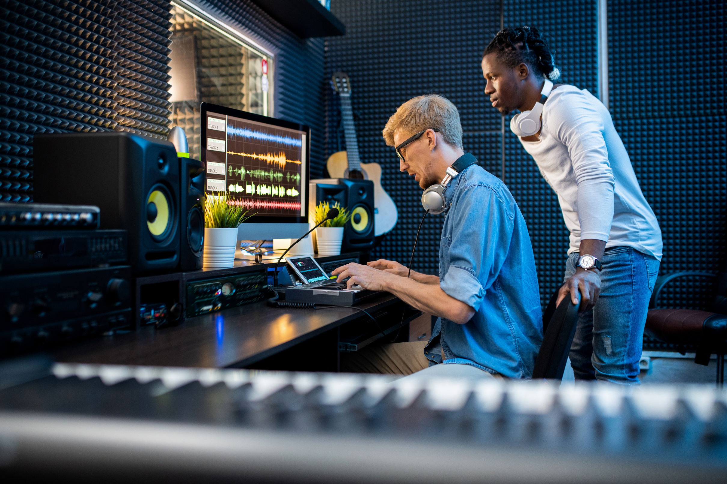 Music Producers Working on a Song in Studio