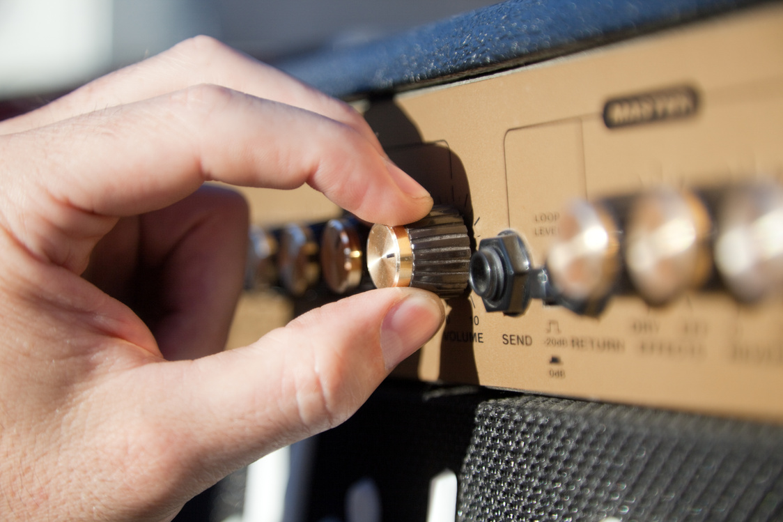 Close up of a Hand Controlling the Volume